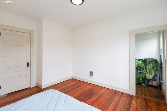 22621 Noti Loop, Noti, OR 97461 - unfurnished bedroom featuring wood finished floors, baseboards, and crown molding