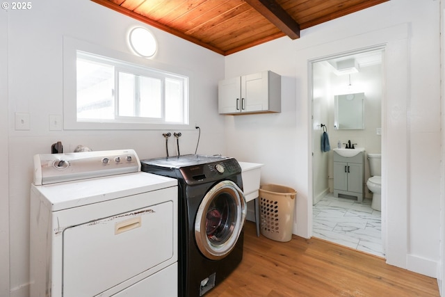 22621 Noti Loop, Noti, OR 97461 - laundry room with wood ceiling, washing machine and dryer, and light wood-style floors