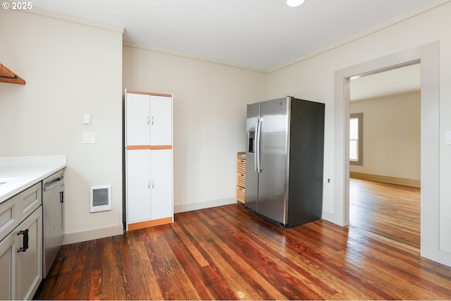 22621 Noti Loop, Noti, OR 97461 - kitchen featuring stainless steel appliances, dark wood-type flooring, light countertops, and baseboards