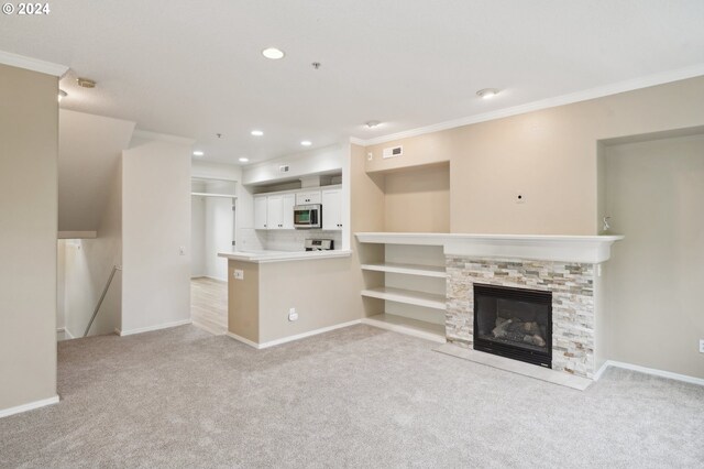 unfurnished living room with light carpet, crown molding, and recessed lighting