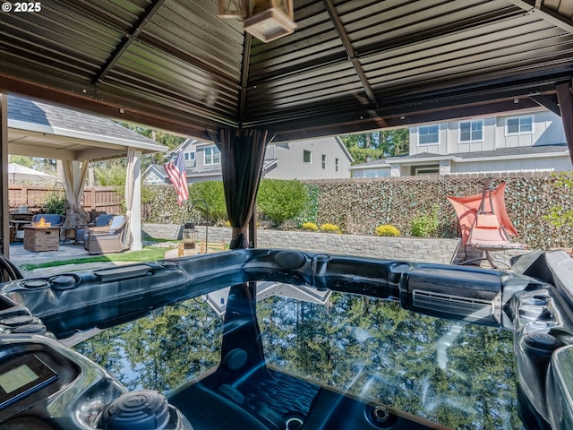 view of swimming pool with a fenced backyard and an outdoor fire pit