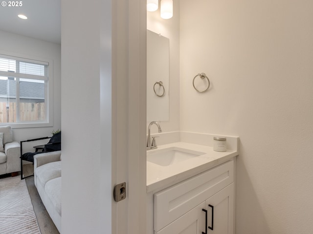 bathroom with connected bathroom and vanity