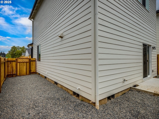 view of property exterior with fence