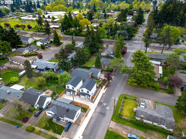 birds eye view of property with a residential view