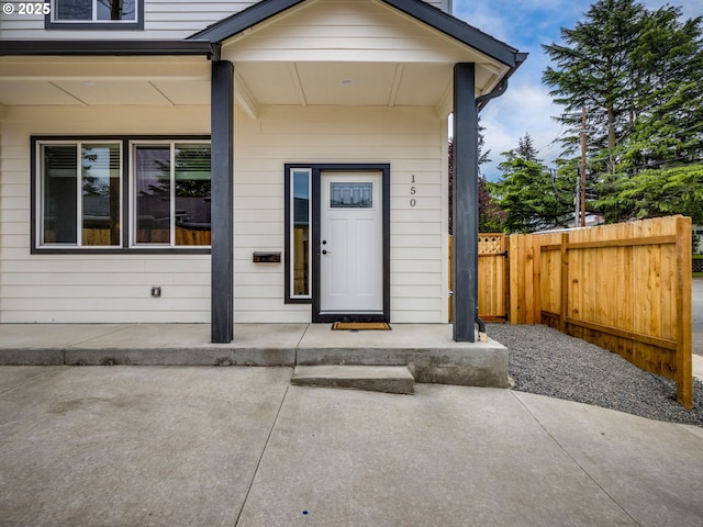 doorway to property with fence