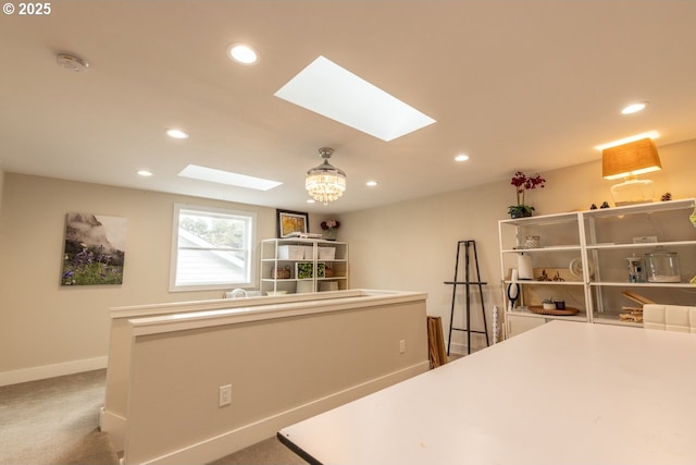 kitchen featuring carpet floors, recessed lighting, and baseboards