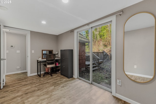 home office with hardwood / wood-style flooring