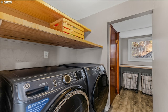 clothes washing area with dark hardwood / wood-style floors and washing machine and clothes dryer