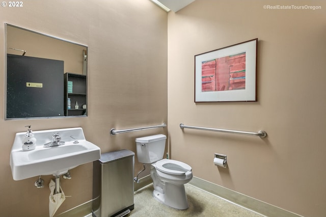 1325 NW Flanders St, Portland, OR 97209 - bathroom with a sink, baseboards, and toilet
