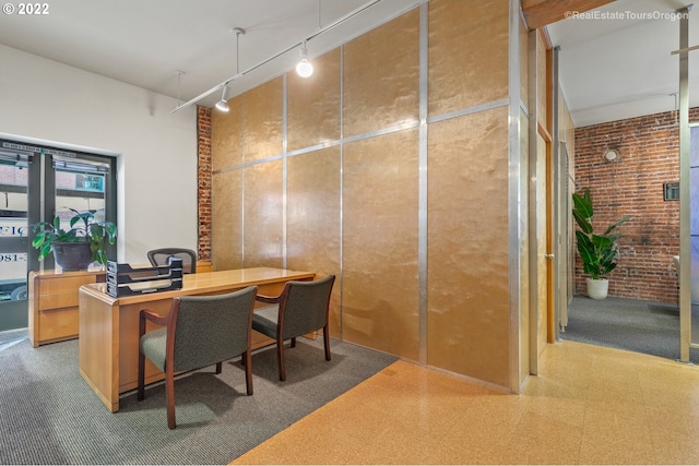 1325 NW Flanders St, Portland, OR 97209 - office space with rail lighting, a high ceiling, tile patterned floors, and brick wall