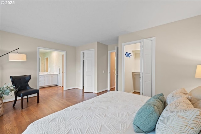31560 SW Arbor Glen Loop, Wilsonville, OR 97070 - bedroom featuring baseboards, ensuite bath, wood finished floors, and a closet
