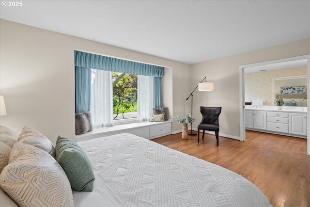 31560 SW Arbor Glen Loop, Wilsonville, OR 97070 - bedroom featuring baseboards, ensuite bath, and wood finished floors