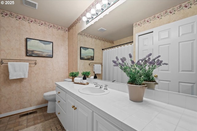 31560 SW Arbor Glen Loop, Wilsonville, OR 97070 - bathroom featuring visible vents, baseboards, toilet, and wallpapered walls