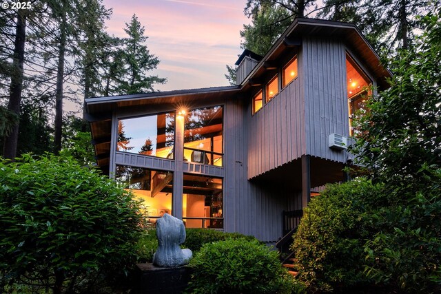 view of back of house at dusk