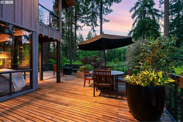 wooden deck with outdoor dining area