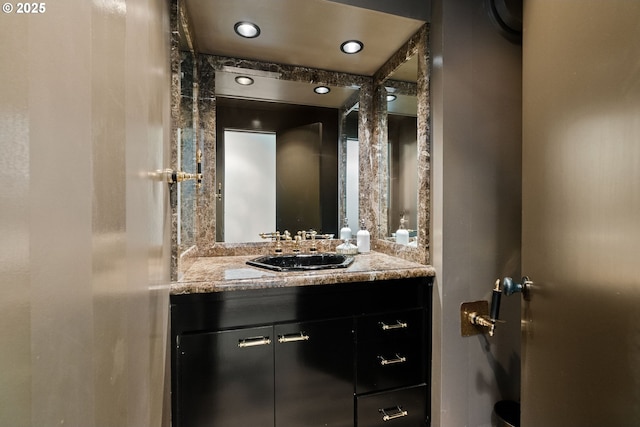 bathroom with vanity and recessed lighting