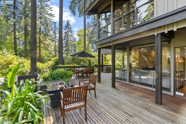 wooden deck featuring outdoor dining space