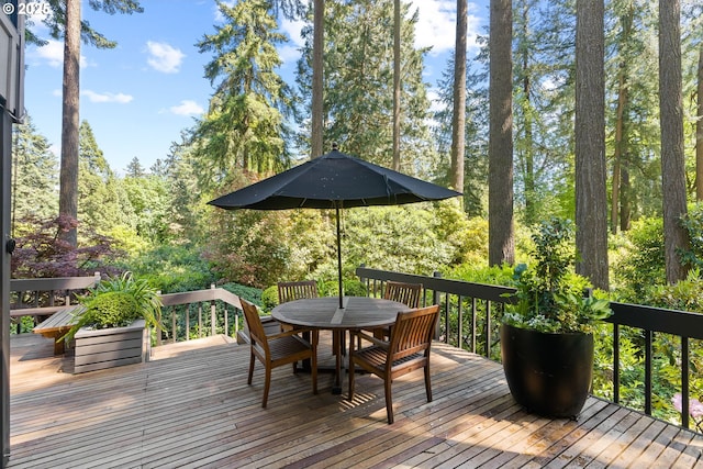 deck featuring outdoor dining area
