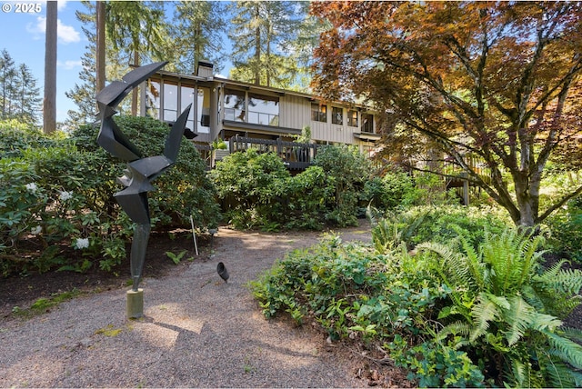 view of home's community featuring a wooden deck