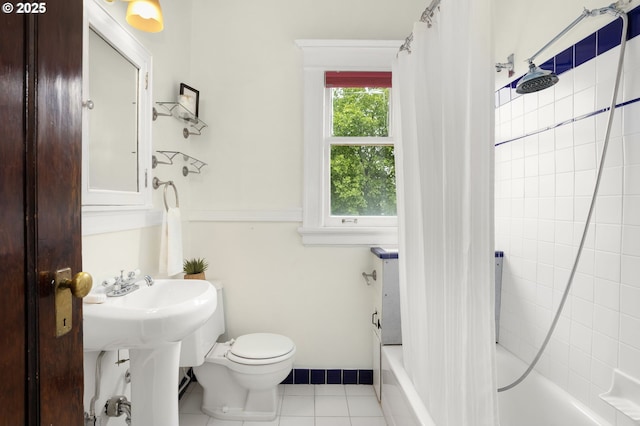 2083 NW Johnson St Unit 45, Portland, OR 97209 - bathroom featuring tile patterned flooring, shower / bathtub combination with curtain, and toilet