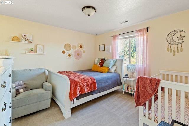 carpeted bedroom with visible vents