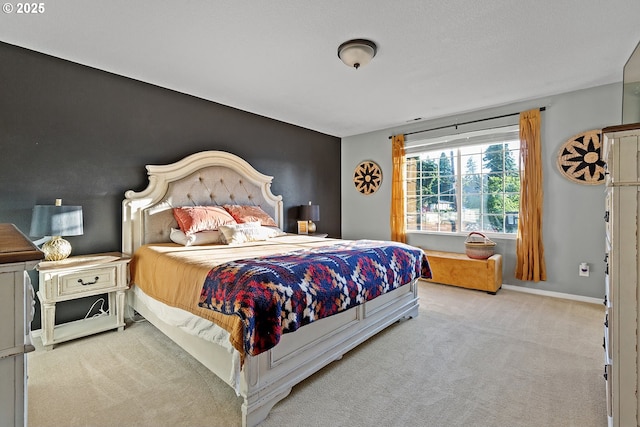 bedroom featuring carpet floors and baseboards