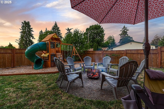 exterior space featuring a fenced backyard and a playground