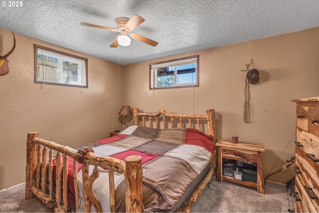 331 Hemlock Ln, Roseburg, OR 97471 - bedroom with a ceiling fan, carpet flooring, a textured ceiling, and a textured wall