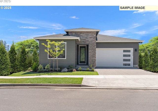 2756 N 49th Ave, Camas, WA 98607 - view of front of home featuring a garage, driveway, stone siding, and a front yard