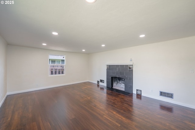 562 Gatch St, Woodburn, OR 97071 - unfurnished living room with wood finished floors, baseboards, recessed lighting, and a tile fireplace
