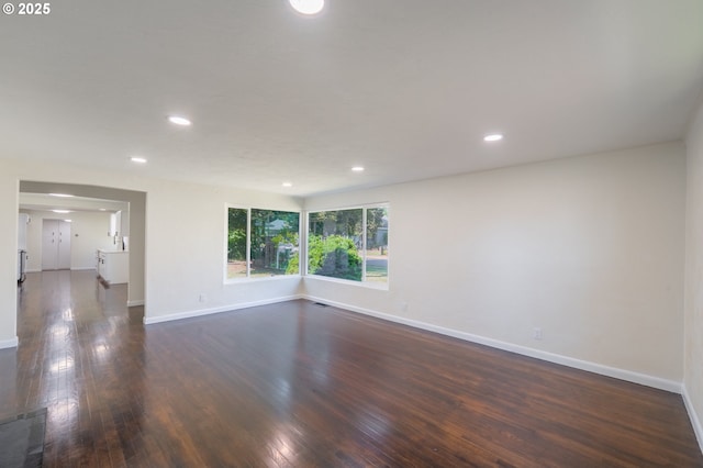562 Gatch St, Woodburn, OR 97071 - unfurnished room with baseboards, dark wood-type flooring, and recessed lighting