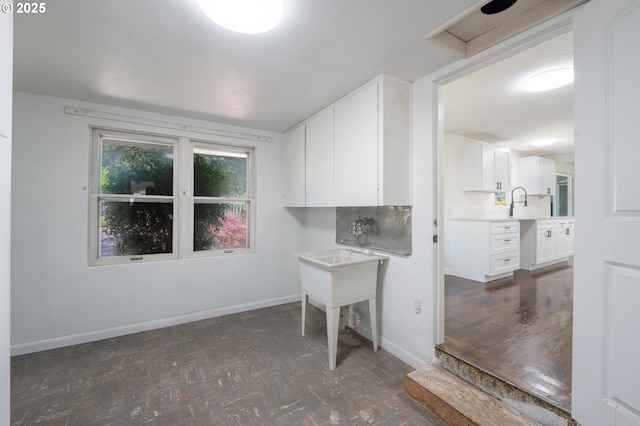 562 Gatch St, Woodburn, OR 97071 - laundry room with baseboards and parquet floors