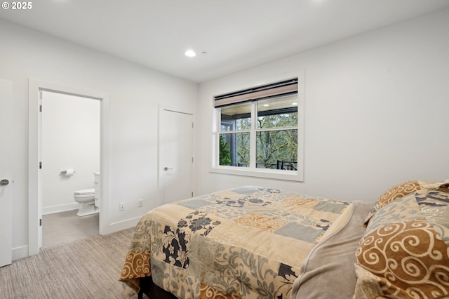 bedroom with carpet flooring, ensuite bathroom, recessed lighting, and baseboards