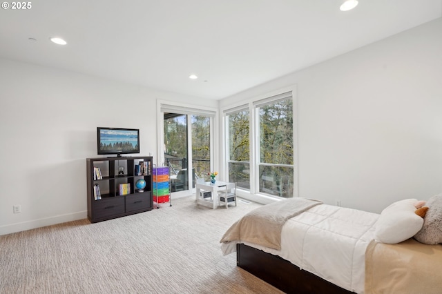 carpeted bedroom featuring recessed lighting and baseboards