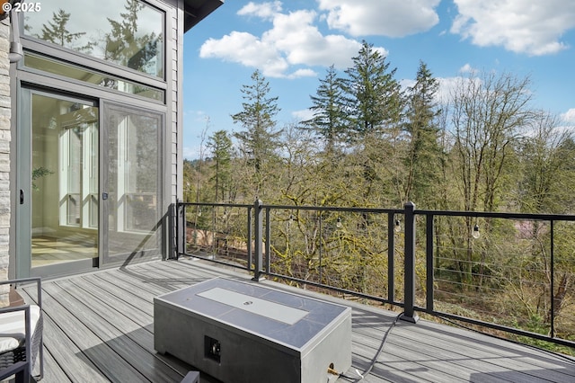 deck featuring a hot tub