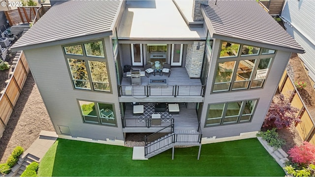 rear view of property featuring a balcony