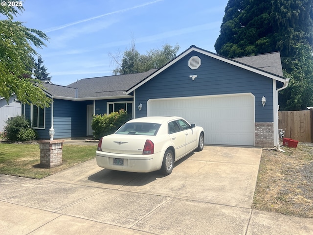 4733 Spring Meadow Ave, Eugene, OR 97404 - single story home with concrete driveway, a garage, and a shingled roof