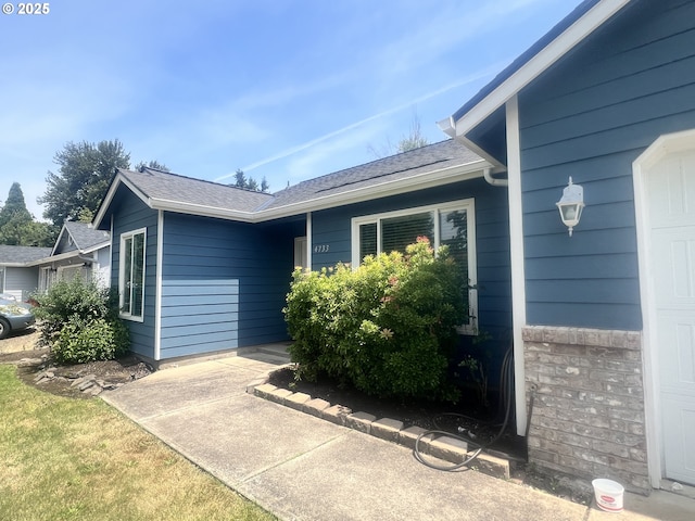 4733 Spring Meadow Ave, Eugene, OR 97404 - view of exterior entry with a shingled roof