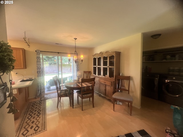4733 Spring Meadow Ave, Eugene, OR 97404 - dining area with separate washer and dryer and light wood-style floors