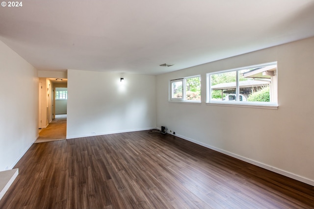 127 Roan Dr, Eugene, OR 97401 - spare room featuring dark wood-type flooring and baseboards