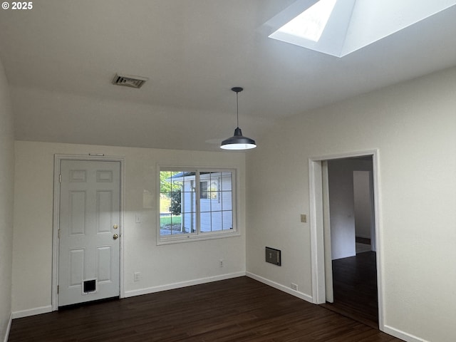 127 Roan Dr, Eugene, OR 97401 - spare room with a skylight, dark wood-style floors, and baseboards