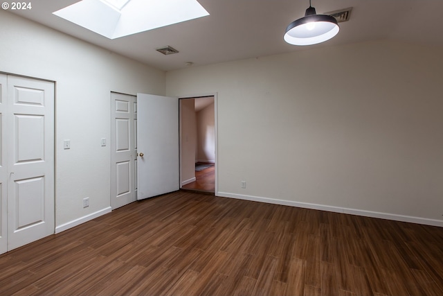 127 Roan Dr, Eugene, OR 97401 - unfurnished bedroom with a skylight, dark wood-style flooring, and baseboards