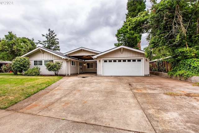 127 Roan Dr, Eugene, OR 97401 - ranch-style house featuring a garage, board and batten siding, and concrete driveway