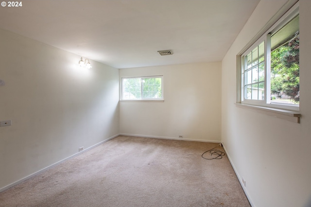 127 Roan Dr, Eugene, OR 97401 - spare room featuring plenty of natural light, carpet floors, and baseboards