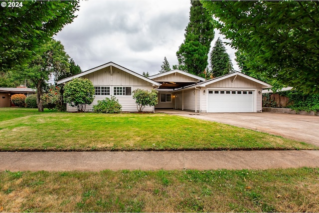 127 Roan Dr, Eugene, OR 97401 - ranch-style home with an attached garage, board and batten siding, and concrete driveway