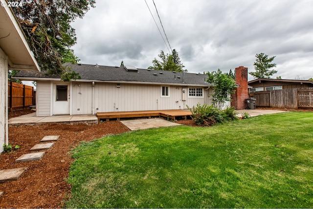 127 Roan Dr, Eugene, OR 97401 - back of property featuring a patio and a deck