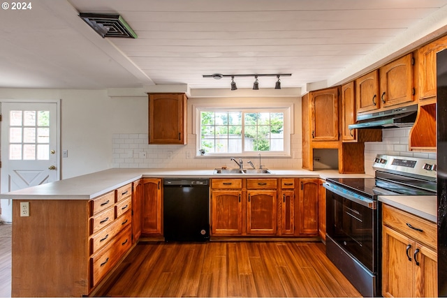 127 Roan Dr, Eugene, OR 97401 - kitchen with black dishwasher, stainless steel electric range, under cabinet range hood, a sink, and a peninsula