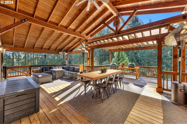 wooden terrace with outdoor dining space and an outdoor living space