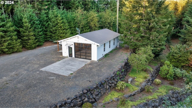 birds eye view of property with a forest view