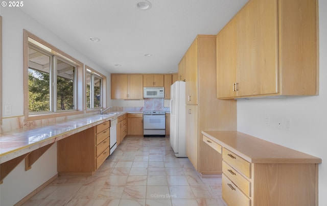 213 University Ave, Manzanita, OR 97130 - kitchen featuring light countertops, white appliances, marble finish floor, and a sink